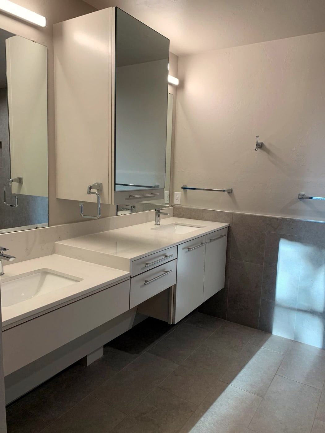 Bathroom with double-sink quartz vanity and gray tile
